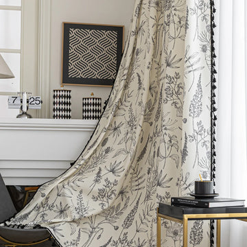 Cream curtain with black botanical print and black tassel trim