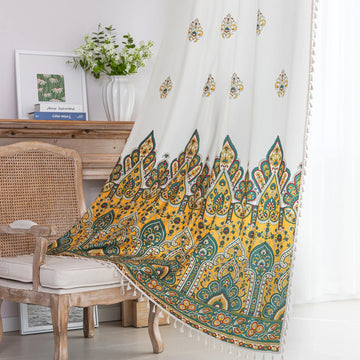 Bohemian Paisley Print Curtains – Brighten your space with these vibrant white curtains featuring an intricate paisley design in rich yellow, green, and red tones. The elegant pattern starts at the base and gracefully fades upward, adding a unique artistic touch to your home décor. Made from lightweight, breathable fabric, they allow soft natural light to flow in while enhancing any living room, bedroom, or creative space with a warm, eclectic charm. Tassel trim along the edges completes the boho-inspired l