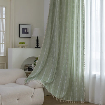 Soft green curtain with delicate vertical white embroidery and tassel trim — an airy and stylish window treatment ideal for creating a light, refreshing, and cozy atmosphere in any room.