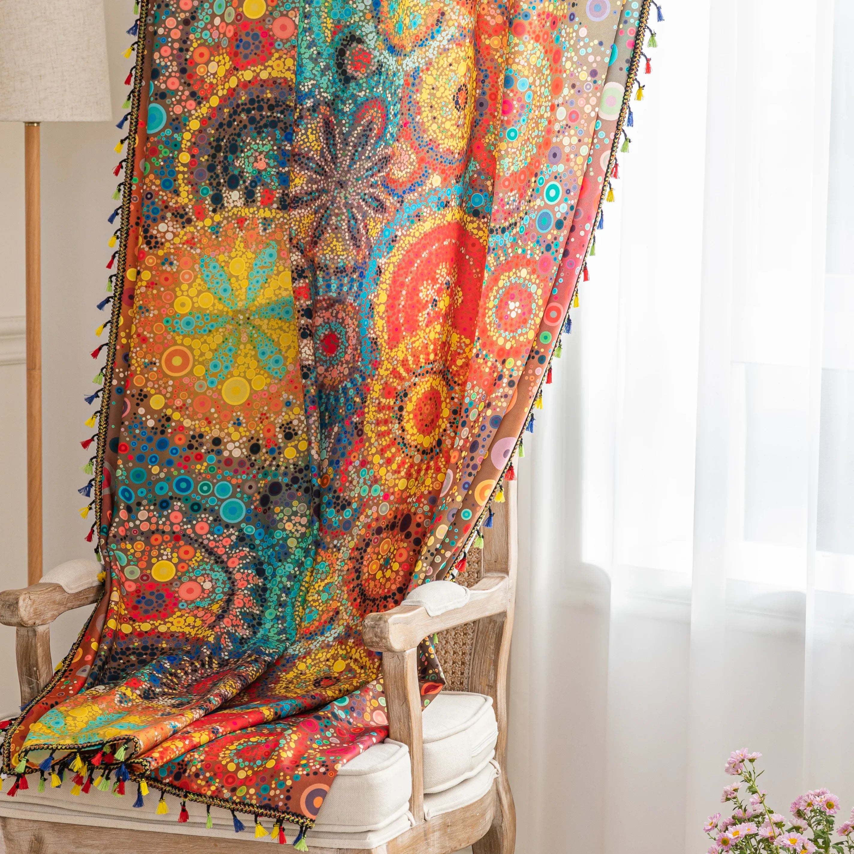 A colorful bohemian curtain with vibrant circular patterns in red, brown, blue, and yellow, decorated with multicolor tassels and braided trim, adding an artistic and lively touch to home d¨¦cor.slider_item_LCniFL