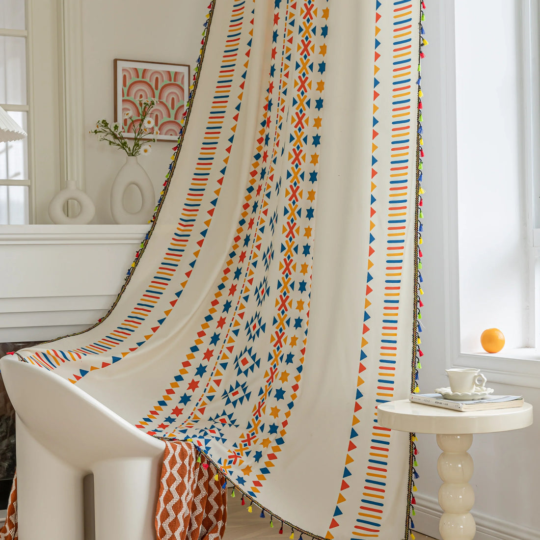 White curtain with colorful geometric patterns in red, yellow, and blue, featuring stripes, triangles, and star motifs, adding a vibrant and modern touch to living room or bedroom decor.