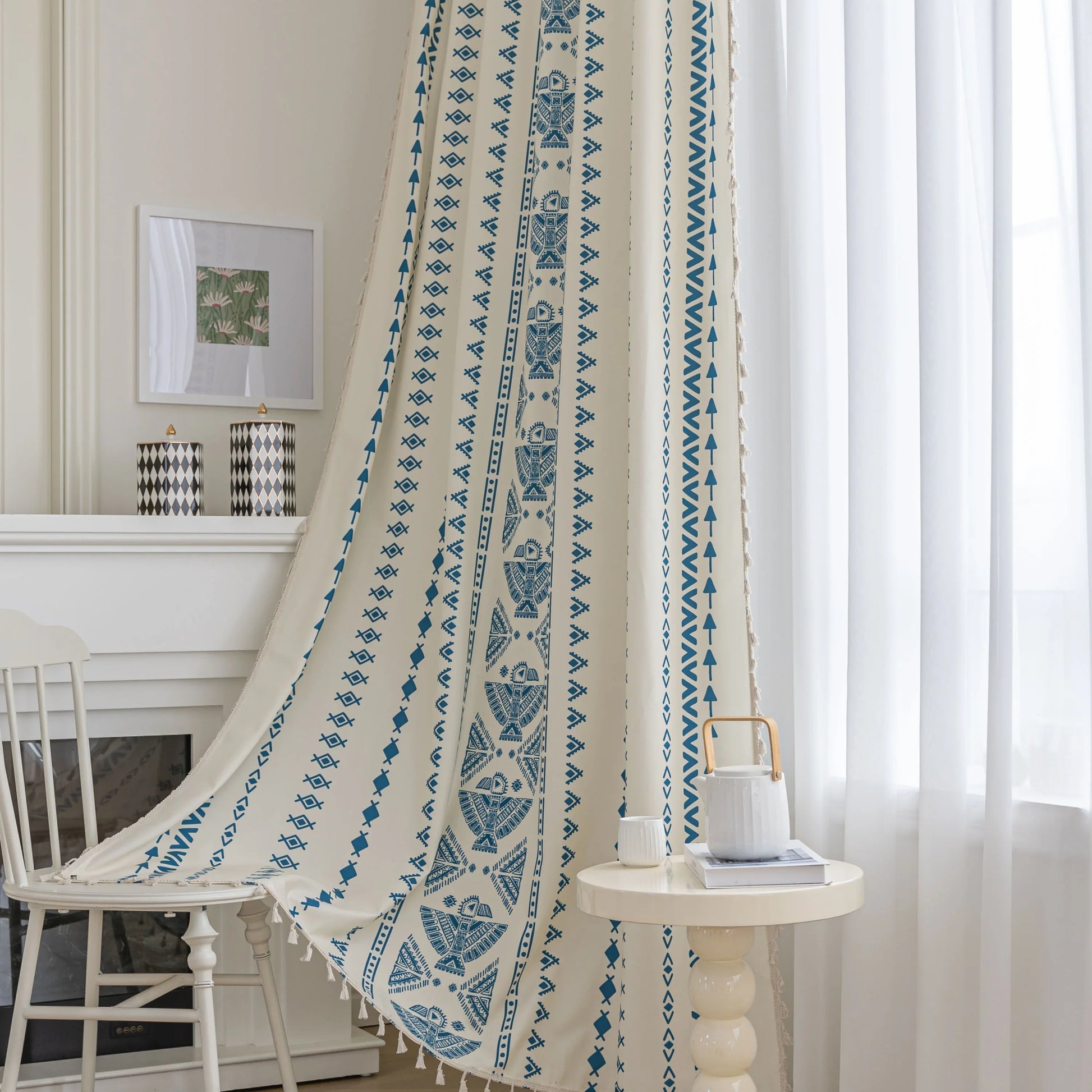Cream curtain with vertical blue geometric and tribal-inspired patterns.