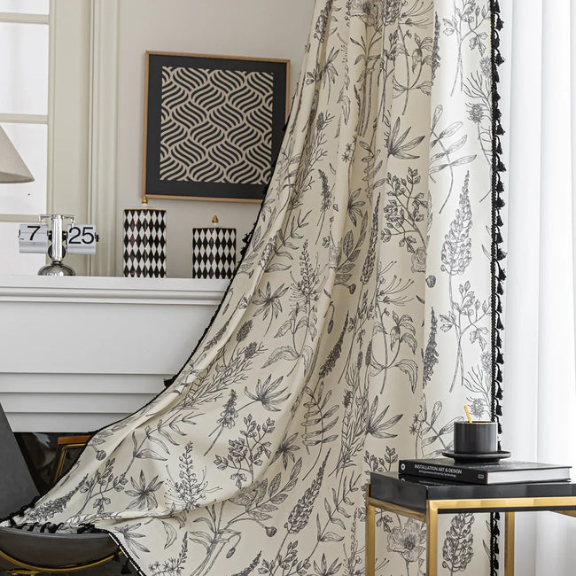 Cream curtain with black botanical print and black tassel trim