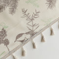Close-up of beige curtain with bird and botanical print in brown and green, featuring decorative tassel trim for a rustic, nature-inspired look.