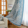 Elegant blue and white patterned curtains with intricate Persian-inspired design.