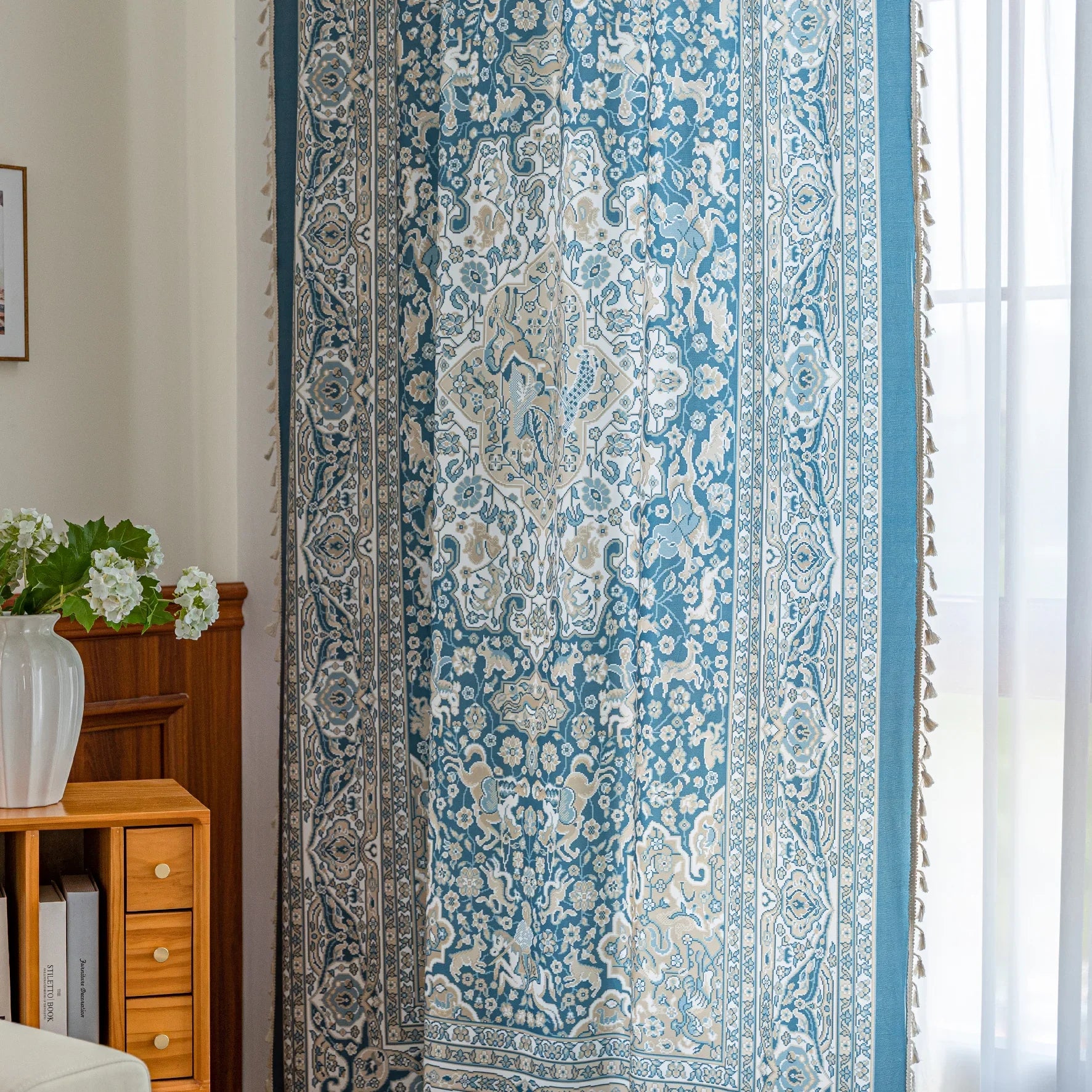 Elegant blue and white patterned curtains with intricate Persian-inspired design.
