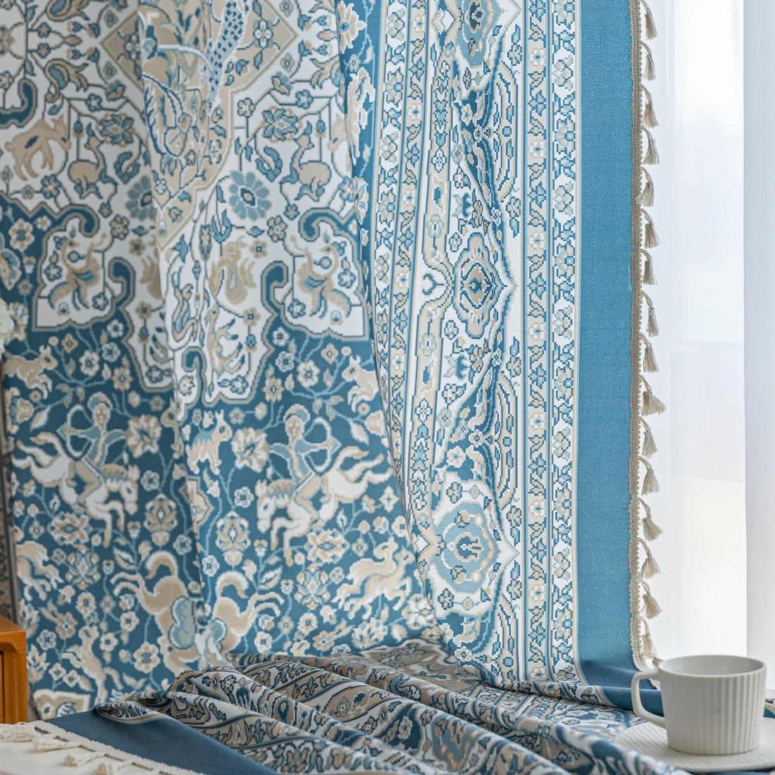 Elegant blue and white patterned curtains with intricate Persian-inspired design.