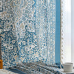 Elegant blue and white patterned curtains with intricate Persian-inspired design.