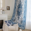 Blue and white curtain fabric with abstract watercolor-style pattern, accented by solid blue border and decorative white tassel trim for a coastal and artistic home d¨¦cor look.