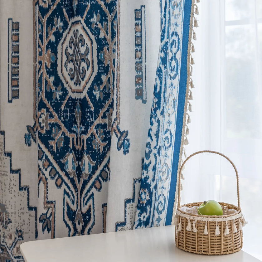 Blue and white curtain fabric with abstract watercolor-style pattern, accented by solid blue border and decorative white tassel trim for a coastal and artistic home d¨¦cor look.