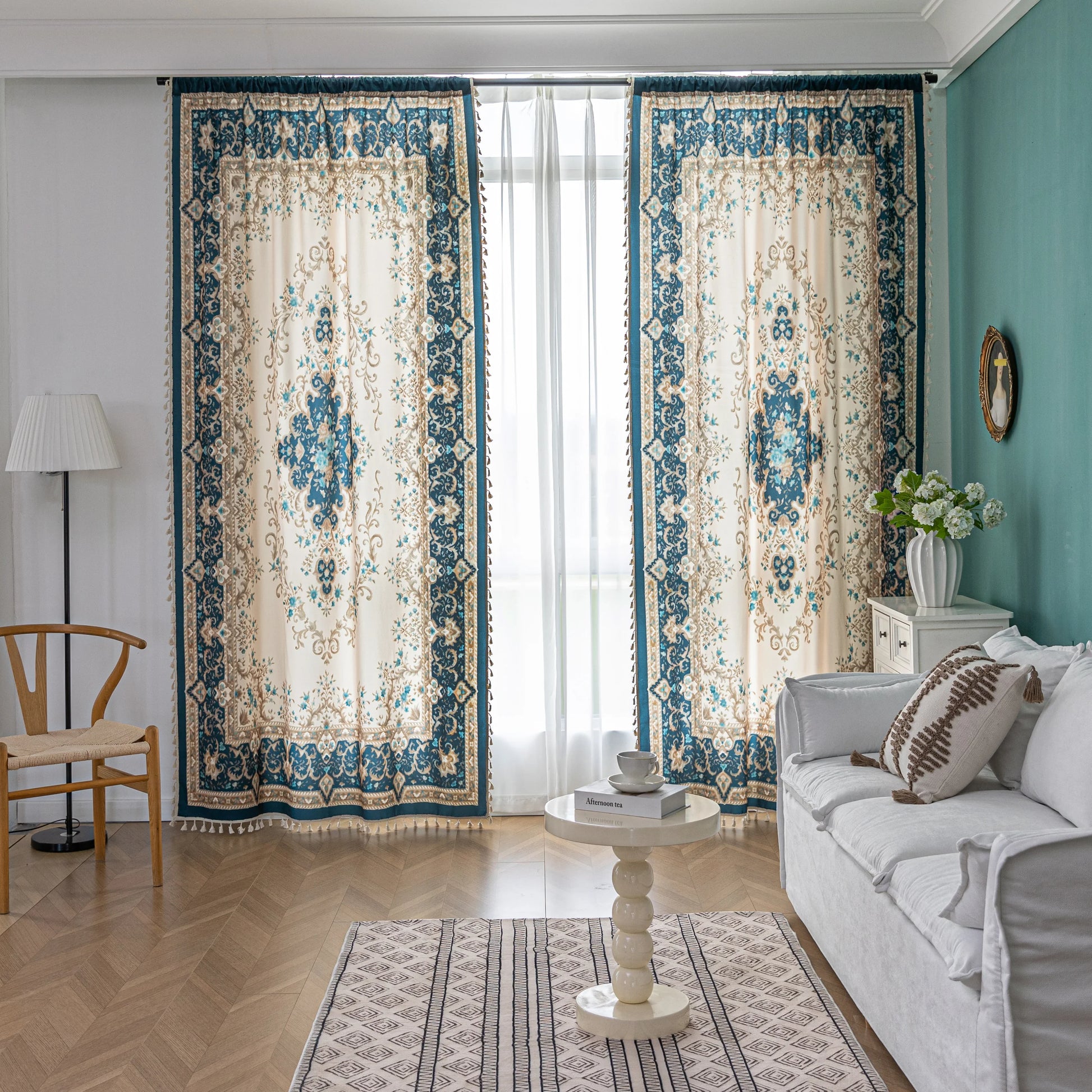 Elegant living room curtains with vintage floral and medallion pattern in teal, beige, and gold tones, featuring ornate borders and sheer white backing for a classic.