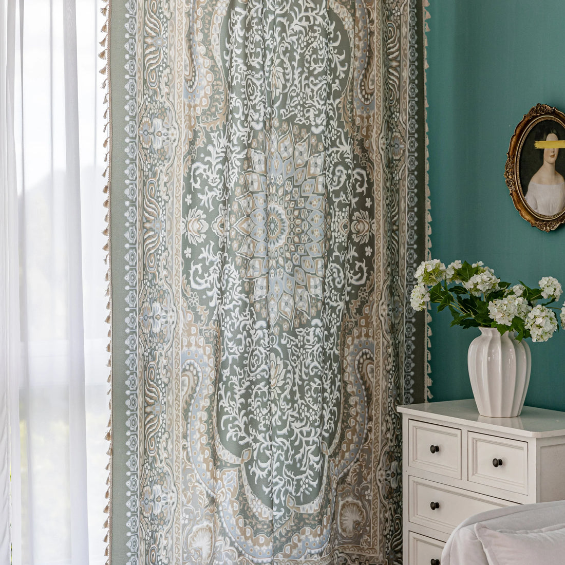 Elegant green curtain with intricate white and beige floral and paisley patterns, featuring a central medallion design, adding a vintage and bohemian charm to home décor.