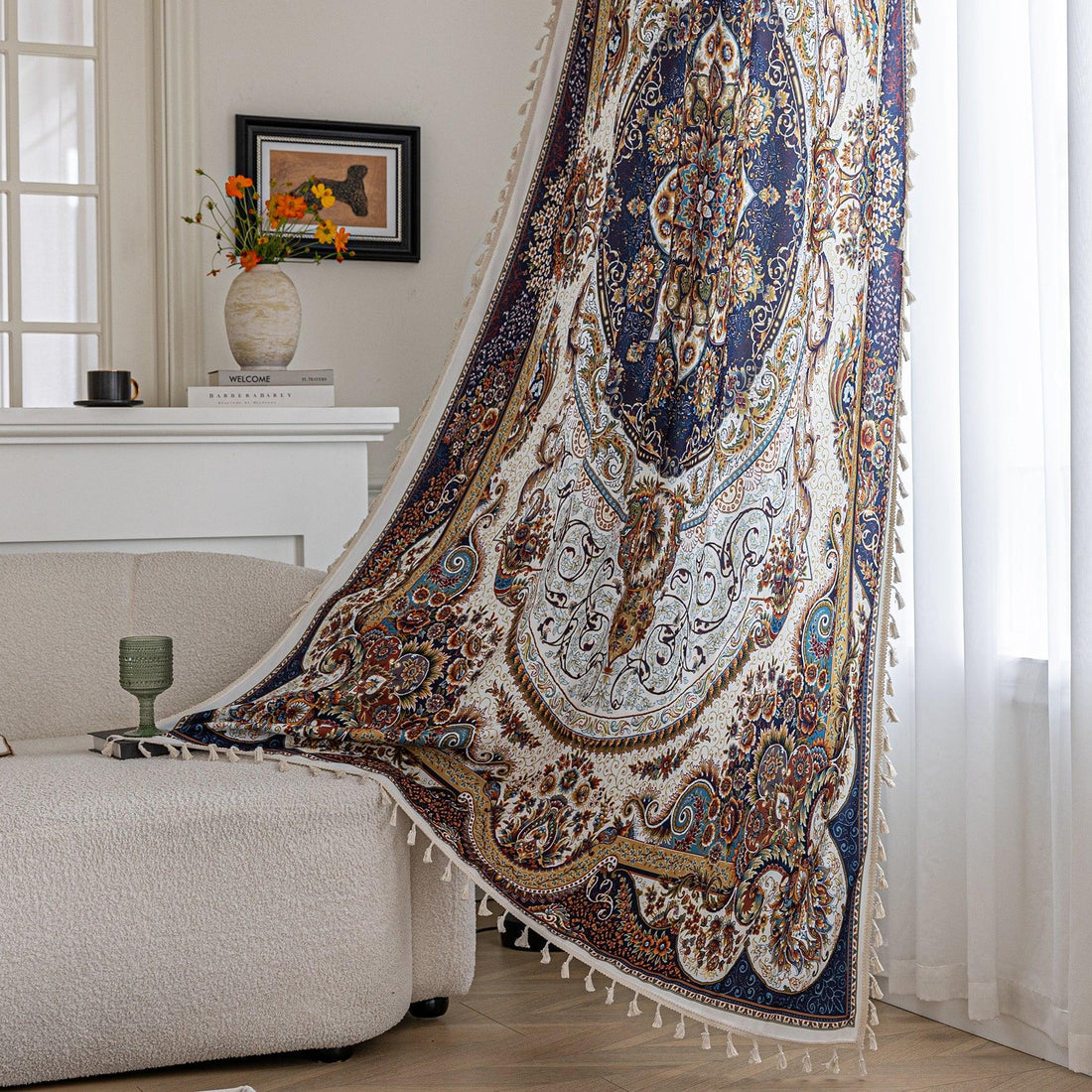 Luxurious bohemian-style curtain with intricate Persian-inspired medallion patterns in navy blue, gold, and white, accented by delicate tassel trim, creating an elegant and artistic home décor statement.