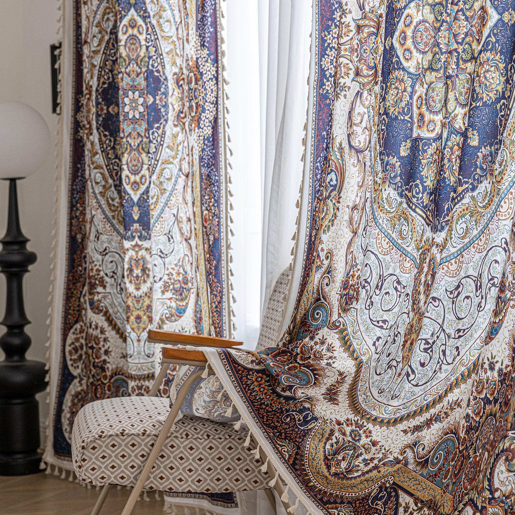 Iuxurious Persian-inspired curtain fabric featuring intricate floral and paisley patterns in navy blue, gold, and rust tones, accented with fine woven details and decorative tassel edging.