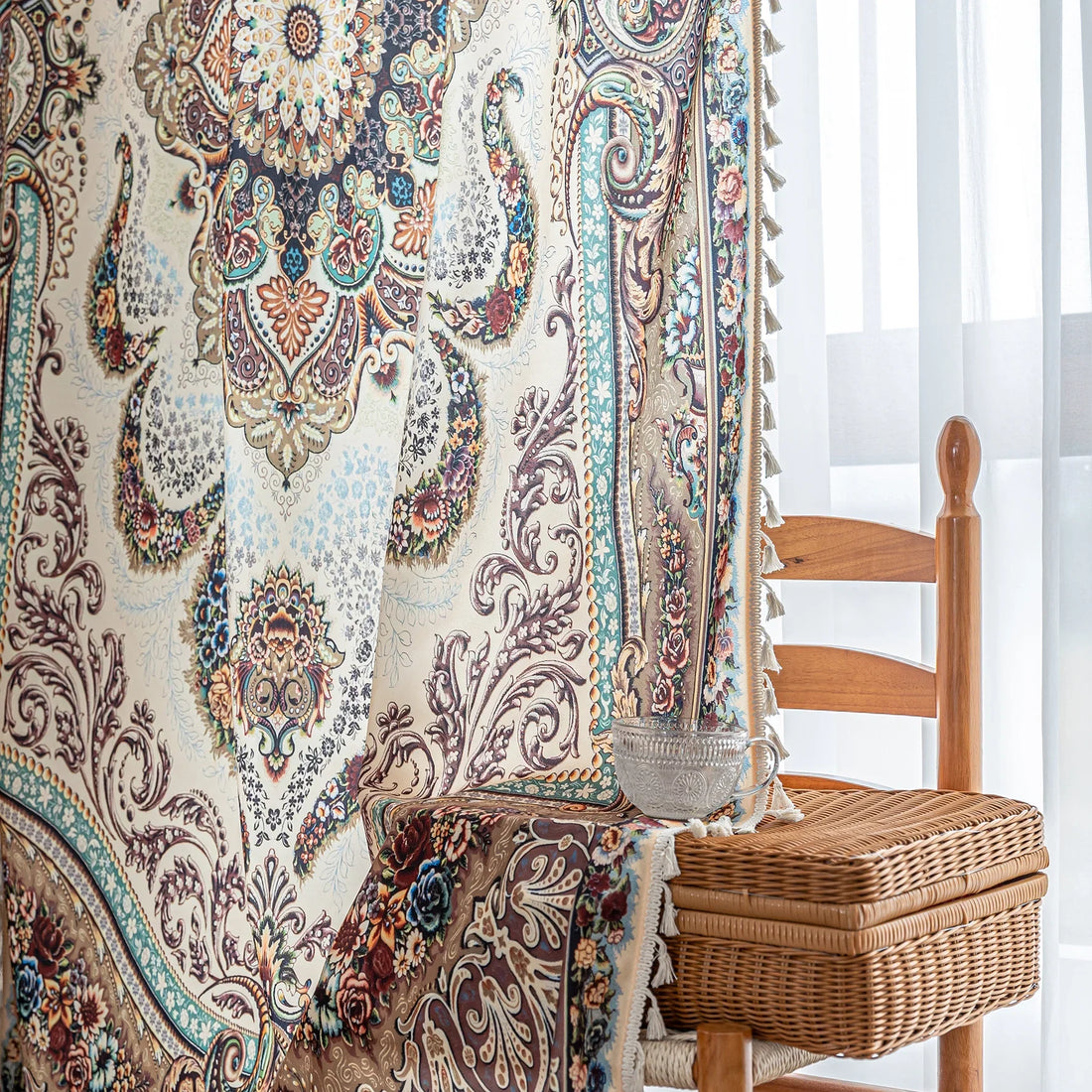 luxurious curtain with intricate floral and paisley patterns in rich brown, teal, and burgundy tones, adorned with delicate tassel trim for an elegant, classic home décor style.