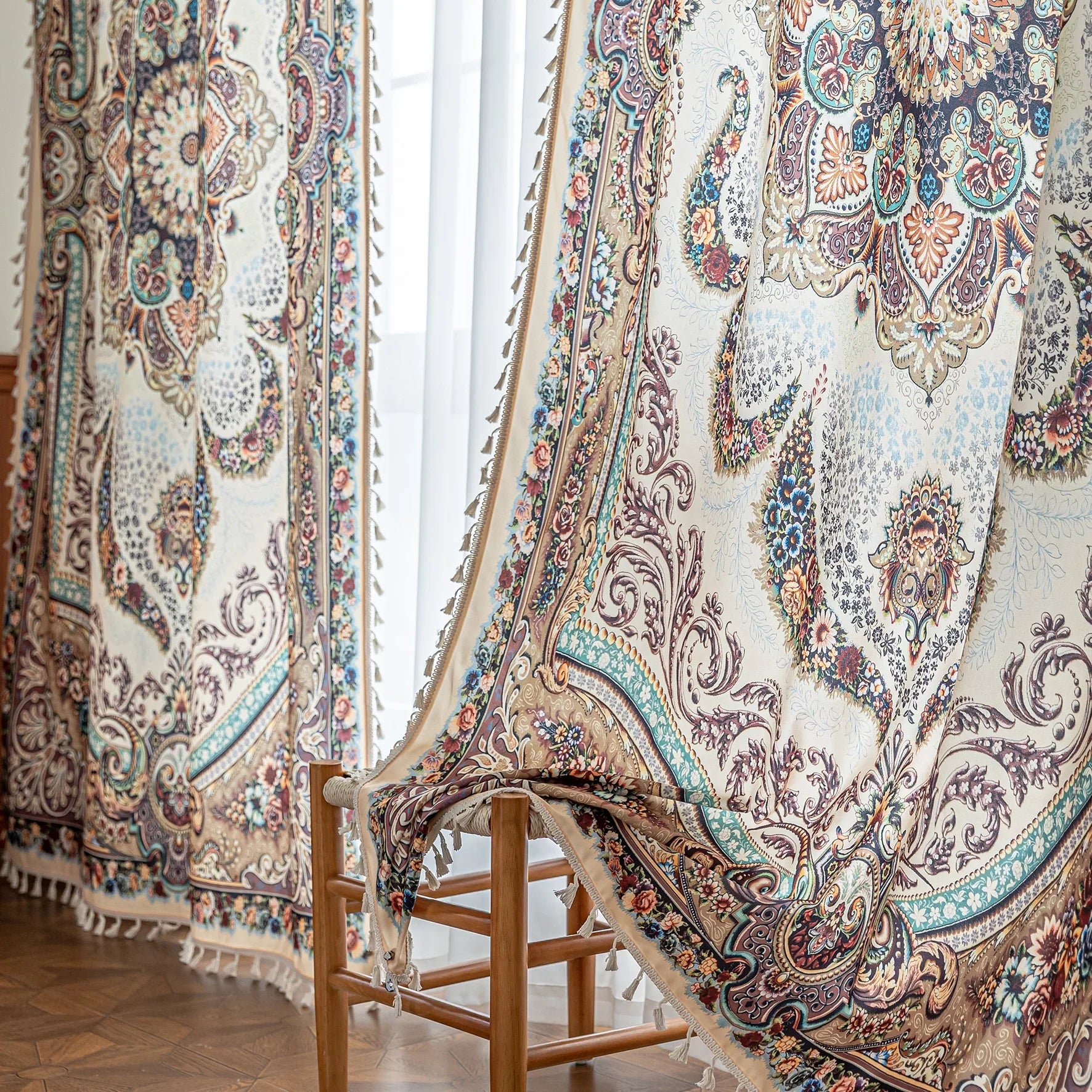 luxurious curtain with intricate floral and paisley patterns in rich brown, teal, and burgundy tones, adorned with delicate tassel trim for an elegant, classic home décor style.