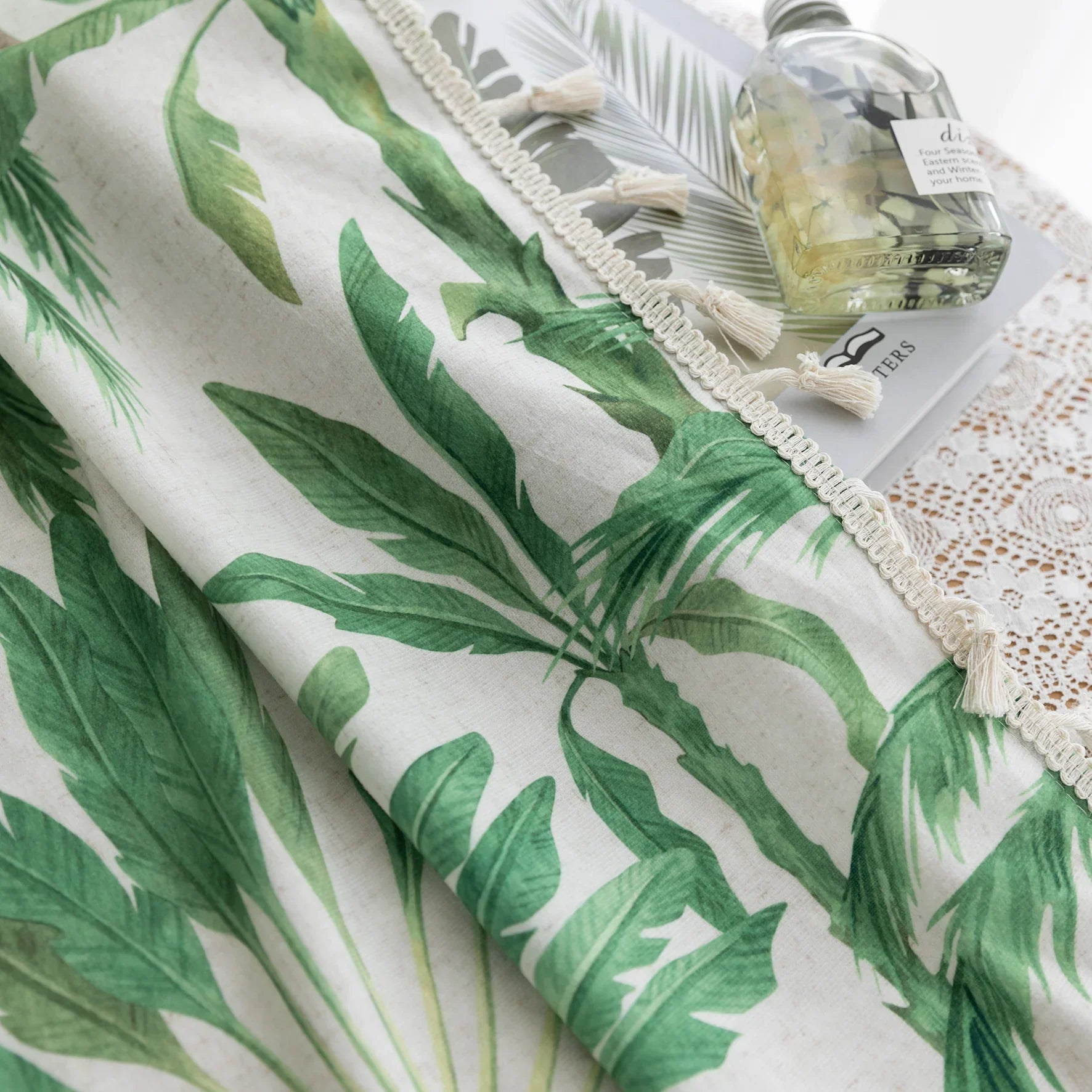 Tropical palm leaf curtain with soft green botanical prints and delicate tassel trim, perfect for adding a fresh, airy, and nature-inspired vibe to your living room, bedroom, or beach house décor.