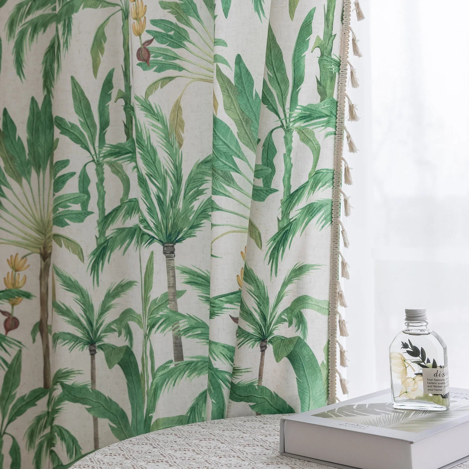 Tropical palm leaf curtain with soft green botanical prints and delicate tassel trim, perfect for adding a fresh, airy, and nature-inspired vibe to your living room, bedroom, or beach house décor.