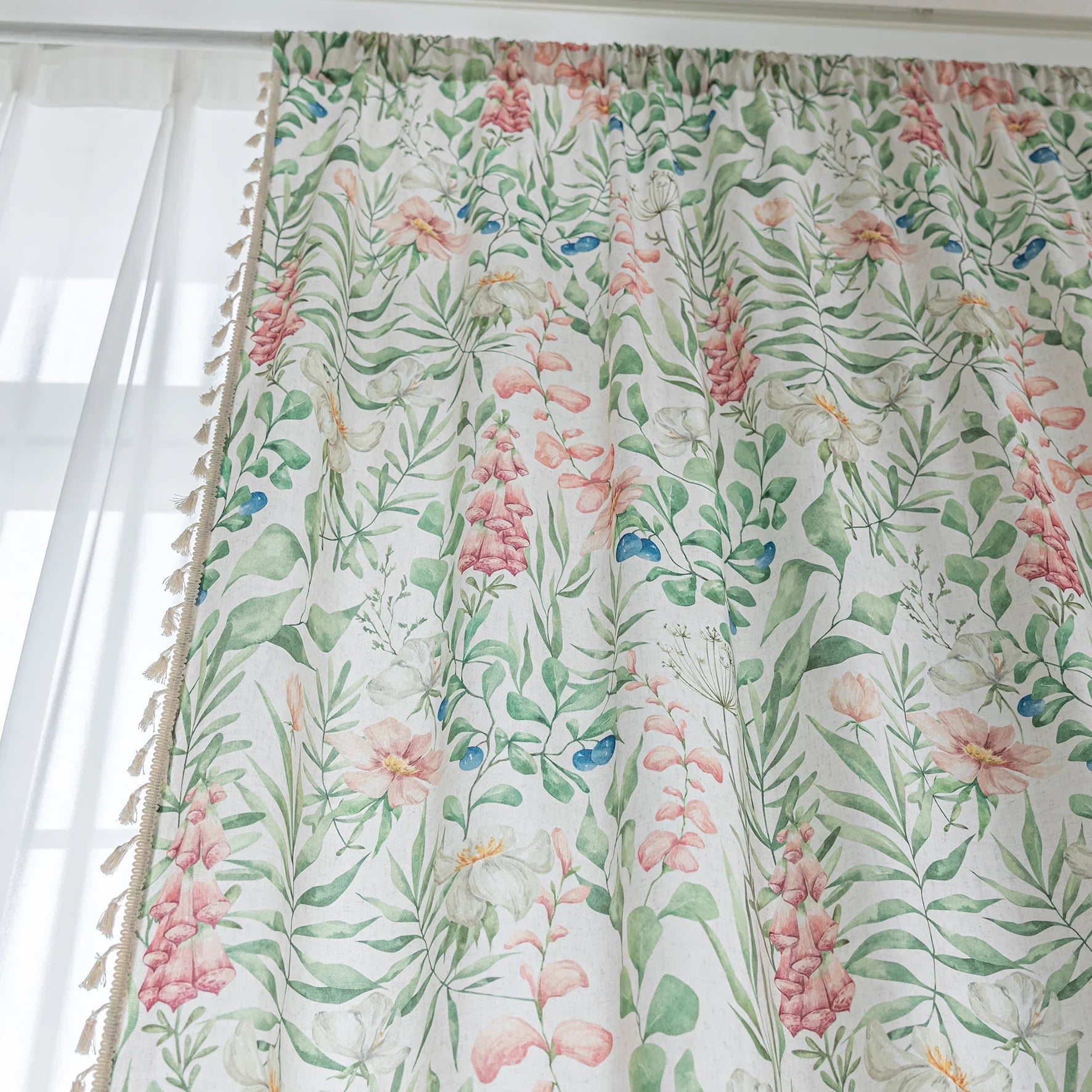 Elegant floral curtain featuring soft pastel blooms, green leafy patterns, and delicate tassel edging — perfect for bringing a fresh, romantic, and nature-inspired charm to your living room, bedroom, or cottage-style décor.