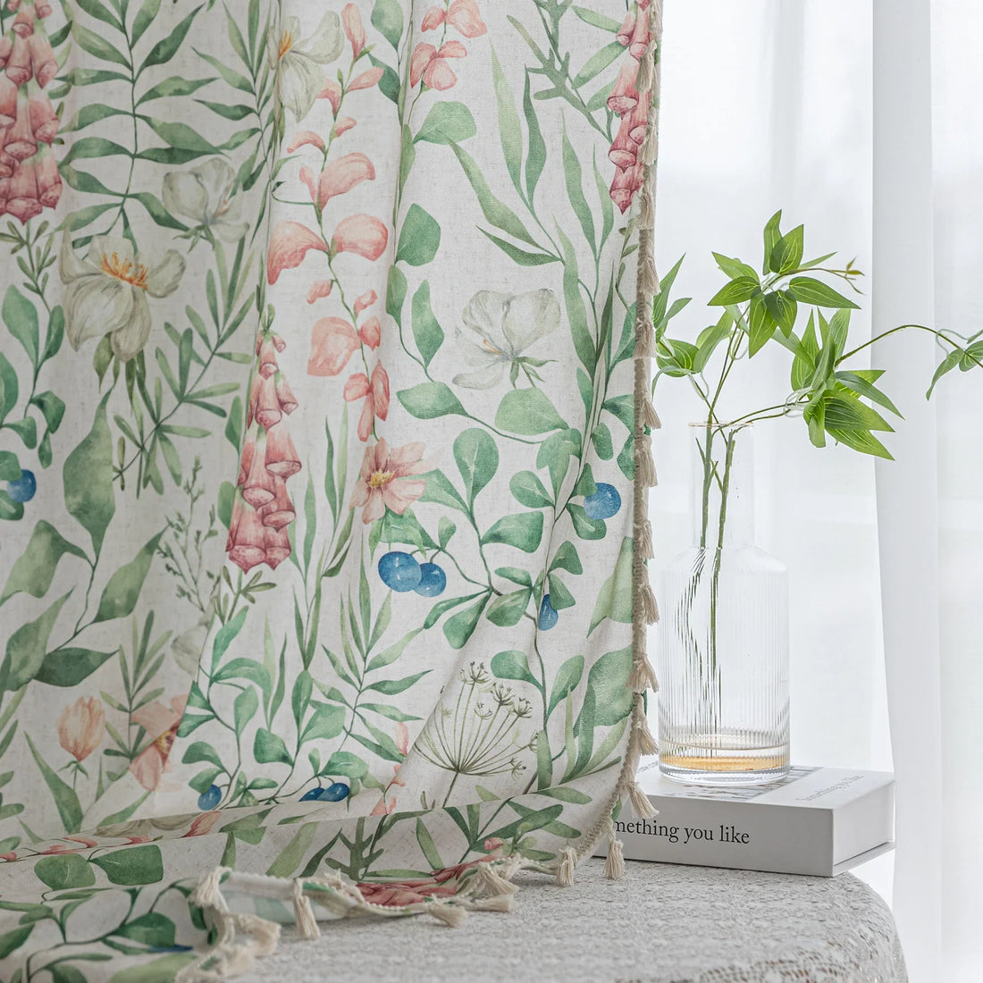 Elegant floral curtain featuring soft pastel blooms, green leafy patterns, and delicate tassel edging — perfect for bringing a fresh, romantic, and nature-inspired charm to your living room, bedroom, or cottage-style décor.