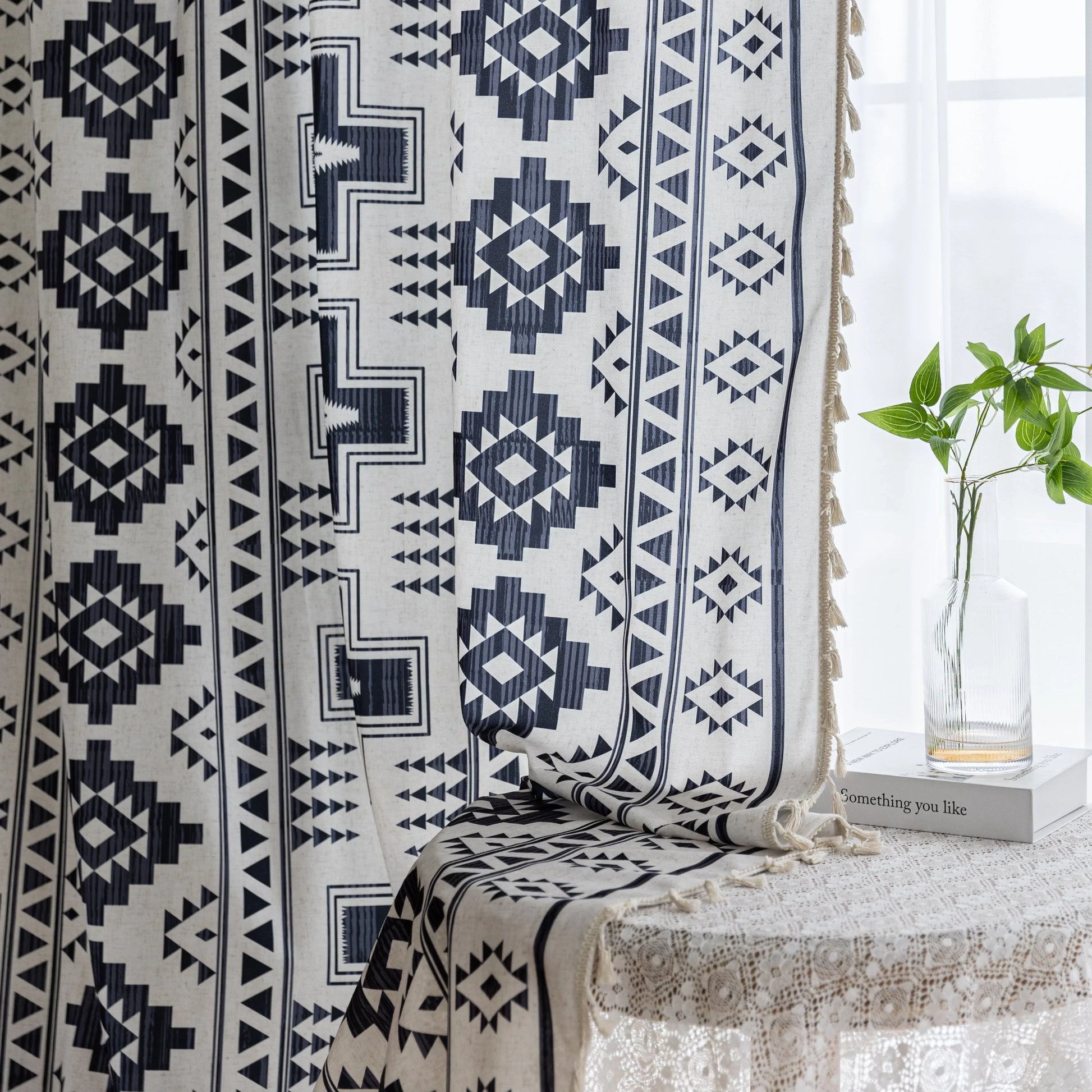 Stylish bohemian curtain featuring bold black geometric and cross patterns on a neutral background, accented with decorative tassel trim — perfect for adding a modern tribal touch to your living room, bedroom, or eclectic home décor.