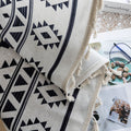 Stylish bohemian curtain featuring bold black geometric and cross patterns on a neutral background, accented with decorative tassel trim — perfect for adding a modern tribal touch to your living room, bedroom, or eclectic home décor.