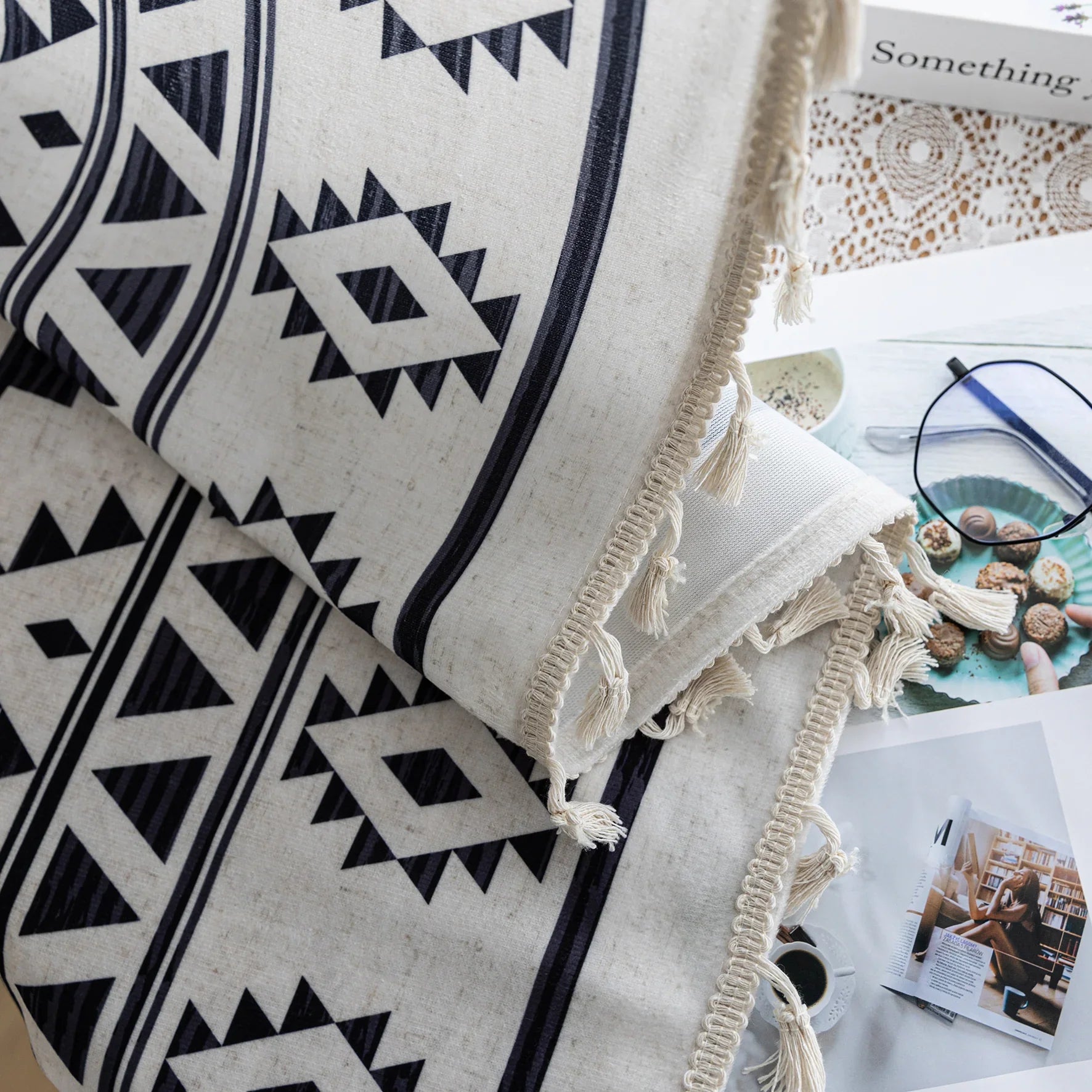 Stylish bohemian curtain featuring bold black geometric and cross patterns on a neutral background, accented with decorative tassel trim — perfect for adding a modern tribal touch to your living room, bedroom, or eclectic home décor.