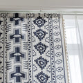 Stylish bohemian curtain featuring bold black geometric and cross patterns on a neutral background, accented with decorative tassel trim — perfect for adding a modern tribal touch to your living room, bedroom, or eclectic home décor.