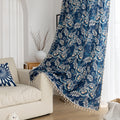 Elegant navy blue curtain adorned with intricate beige floral and leafy patterns, finished with delicate tassel trim — ideal for adding a touch of sophistication and classic charm to living rooms, bedrooms, or vintage-inspired interiors.