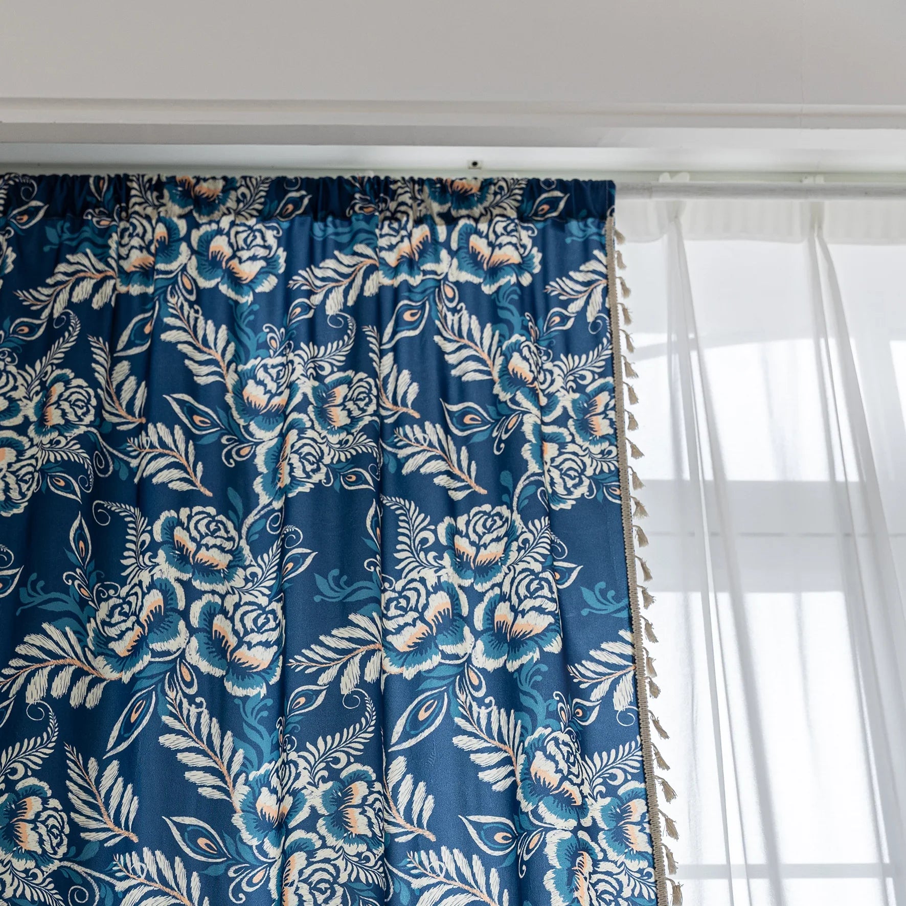 Elegant navy blue curtain adorned with intricate beige floral and leafy patterns, finished with delicate tassel trim — ideal for adding a touch of sophistication and classic charm to living rooms, bedrooms, or vintage-inspired interiors.