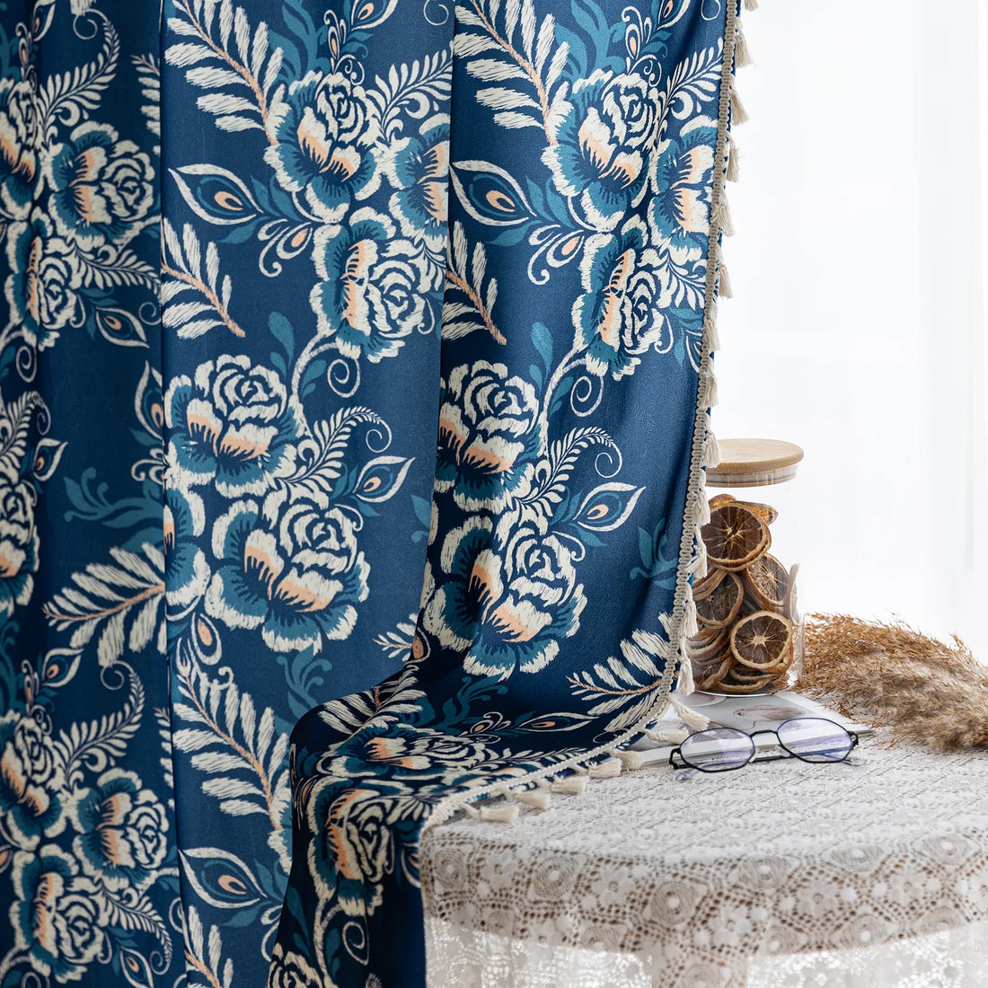 Elegant navy blue curtain adorned with intricate beige floral and leafy patterns, finished with delicate tassel trim — ideal for adding a touch of sophistication and classic charm to living rooms, bedrooms, or vintage-inspired interiors.