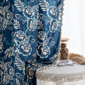 Elegant navy blue curtain adorned with intricate beige floral and leafy patterns, finished with delicate tassel trim — ideal for adding a touch of sophistication and classic charm to living rooms, bedrooms, or vintage-inspired interiors.