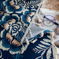 Elegant navy blue curtain adorned with intricate beige floral and leafy patterns, finished with delicate tassel trim — ideal for adding a touch of sophistication and classic charm to living rooms, bedrooms, or vintage-inspired interiors.