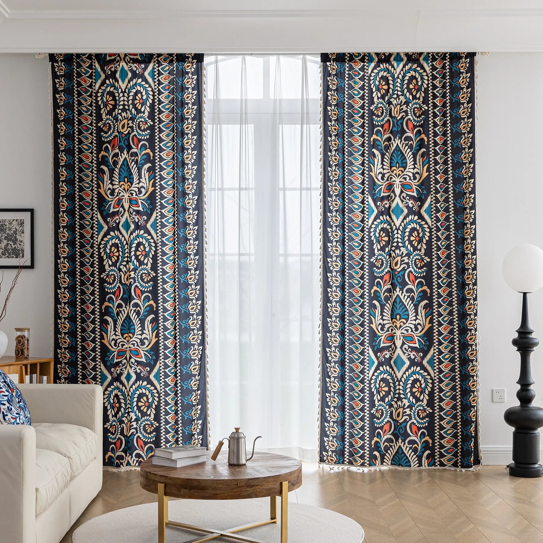 Luxurious bohemian-style curtain featuring a bold black base with intricate beige, red, and teal floral and geometric patterns, finished with elegant tassel trim — perfect for adding vibrant charm and cultural flair to your home décor.