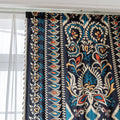Luxurious bohemian-style curtain featuring a bold black base with intricate beige, red, and teal floral and geometric patterns, finished with elegant tassel trim — perfect for adding vibrant charm and cultural flair to your home décor.