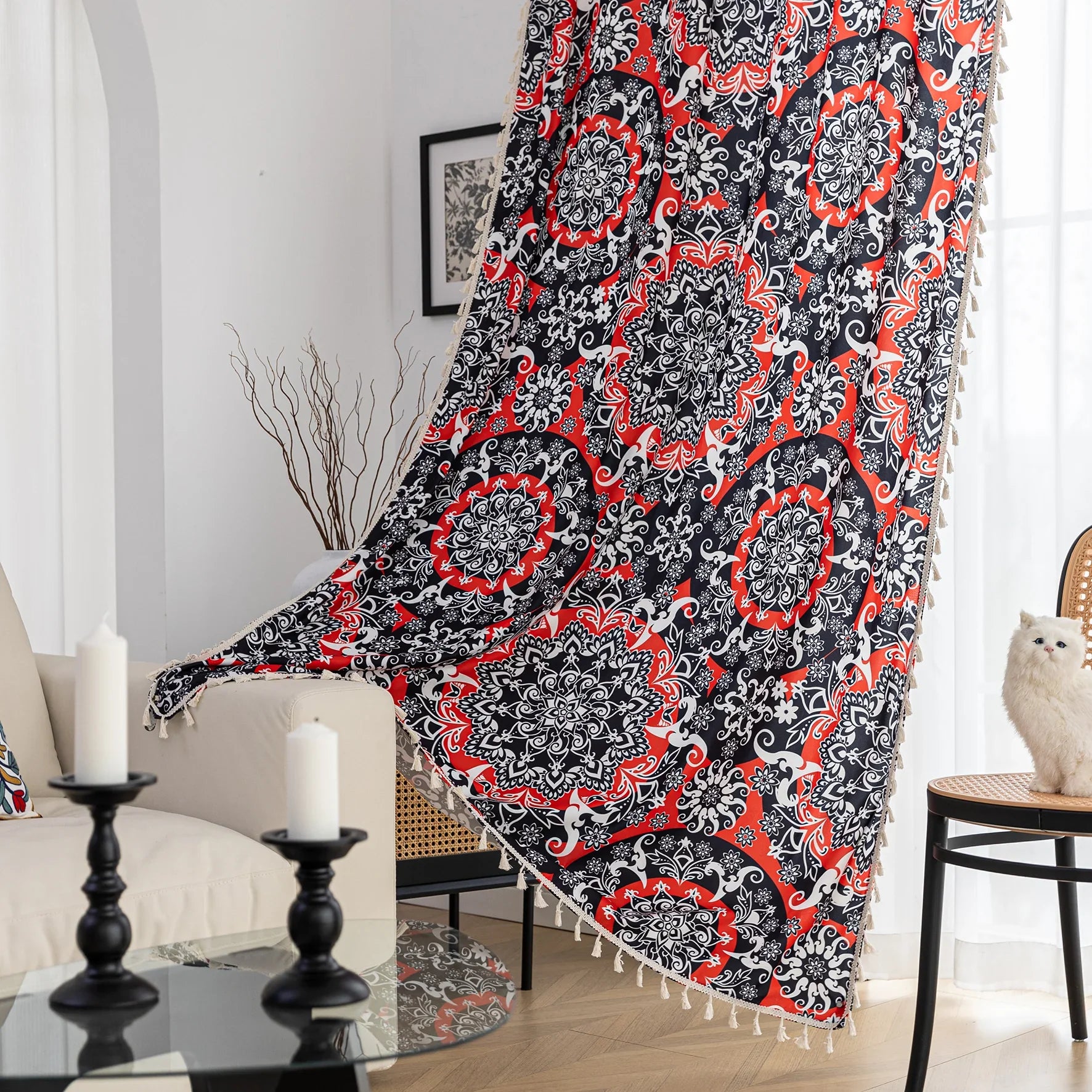 Vibrant bohemian-style curtain with intricate mandala patterns in striking red, black, and white tones, accented with swirling floral details and finished with elegant white tassel trim — perfect for adding bold artistic flair and cultural charm to any living space.