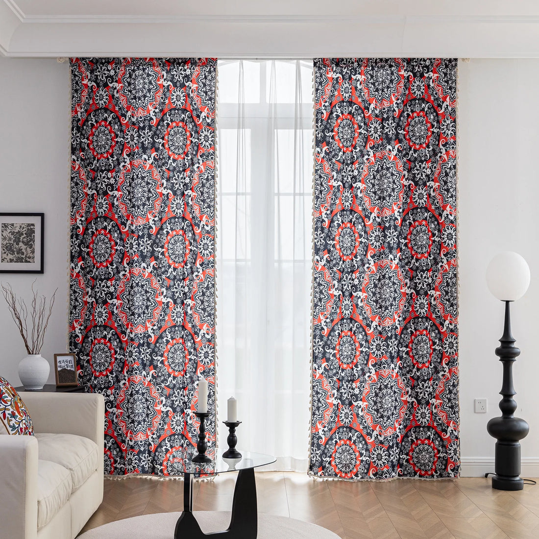 Vibrant bohemian-style curtain with intricate mandala patterns in striking red, black, and white tones, accented with swirling floral details and finished with elegant white tassel trim — perfect for adding bold artistic flair and cultural charm to any living space.