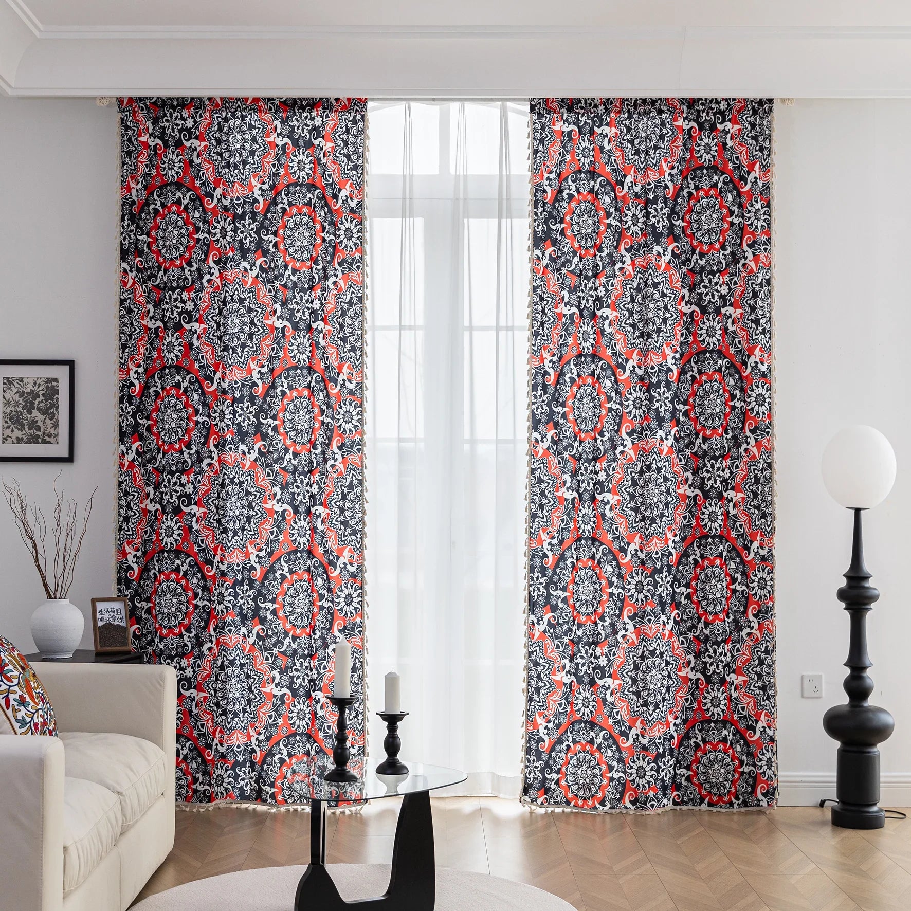 Vibrant bohemian-style curtain with intricate mandala patterns in striking red, black, and white tones, accented with swirling floral details and finished with elegant white tassel trim — perfect for adding bold artistic flair and cultural charm to any living space.