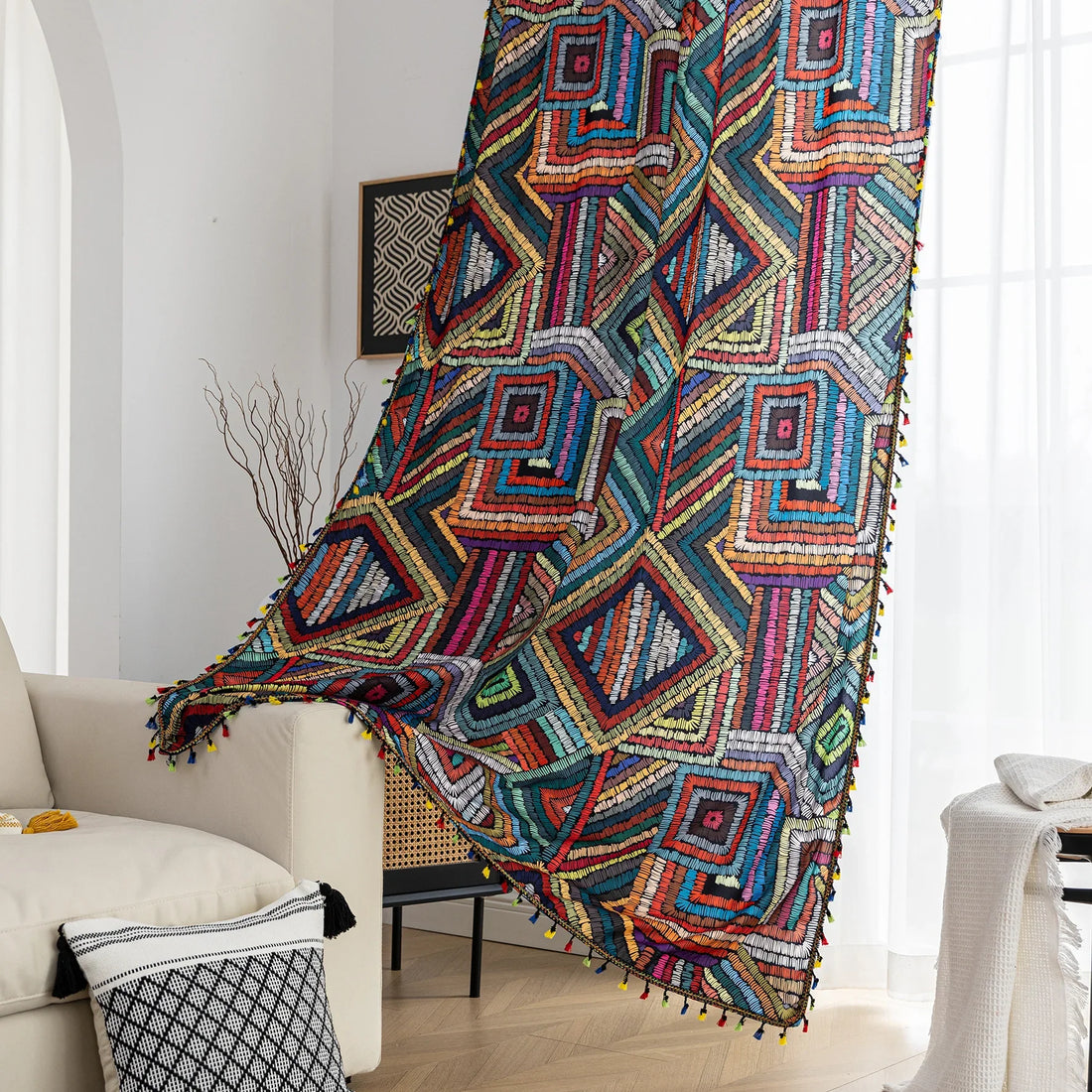 Vibrant geometric bohemian curtain with bold multicolor diamond patterns, featuring intricate woven-style designs and colorful tassel trim — ideal for adding a lively, artistic statement to any room décor.