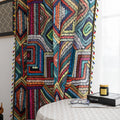 Vibrant geometric bohemian curtain with bold multicolor diamond patterns, featuring intricate woven-style designs and colorful tassel trim — ideal for adding a lively, artistic statement to any room décor.