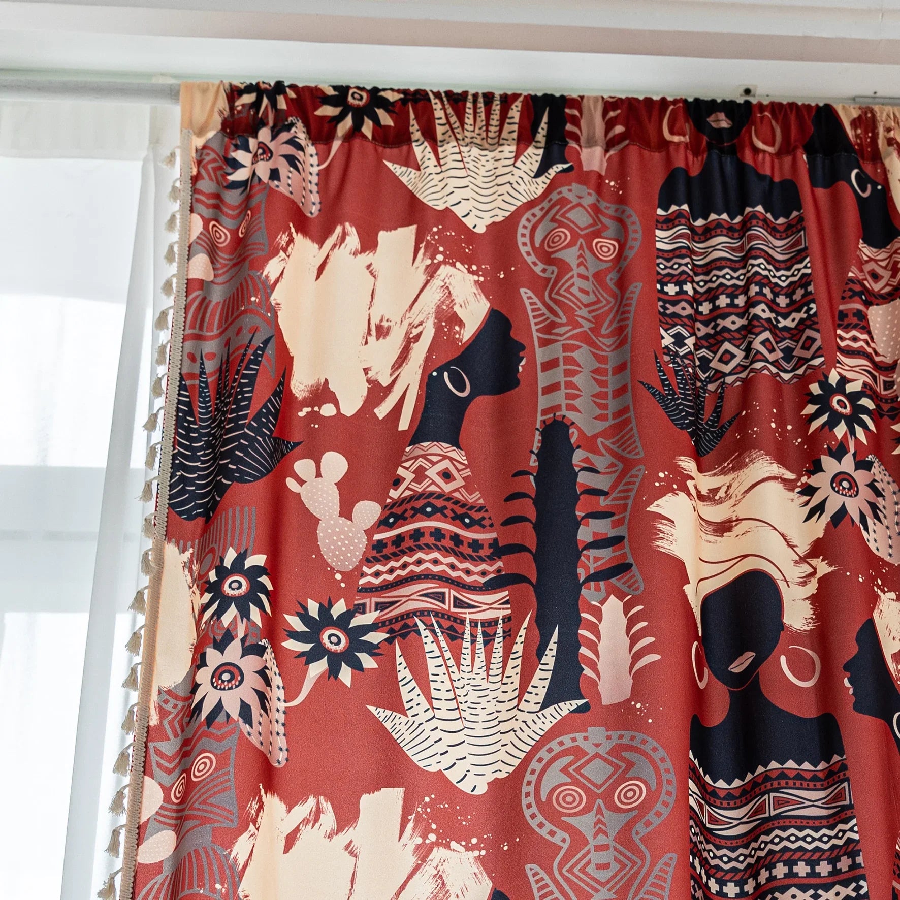 Modern bohemian curtain featuring an abstract tribal-inspired design in earthy terracotta, beige, and black tones, adorned with cactus and floral motifs, and finished with delicate white tassel trim — perfect for adding a warm, artistic touch to your home décor.
