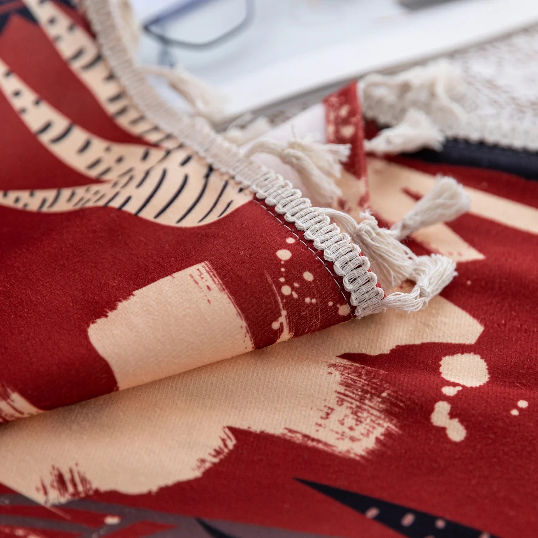 Modern bohemian curtain featuring an abstract tribal-inspired design in earthy terracotta, beige, and black tones, adorned with cactus and floral motifs, and finished with delicate white tassel trim — perfect for adding a warm, artistic touch to your home décor.
