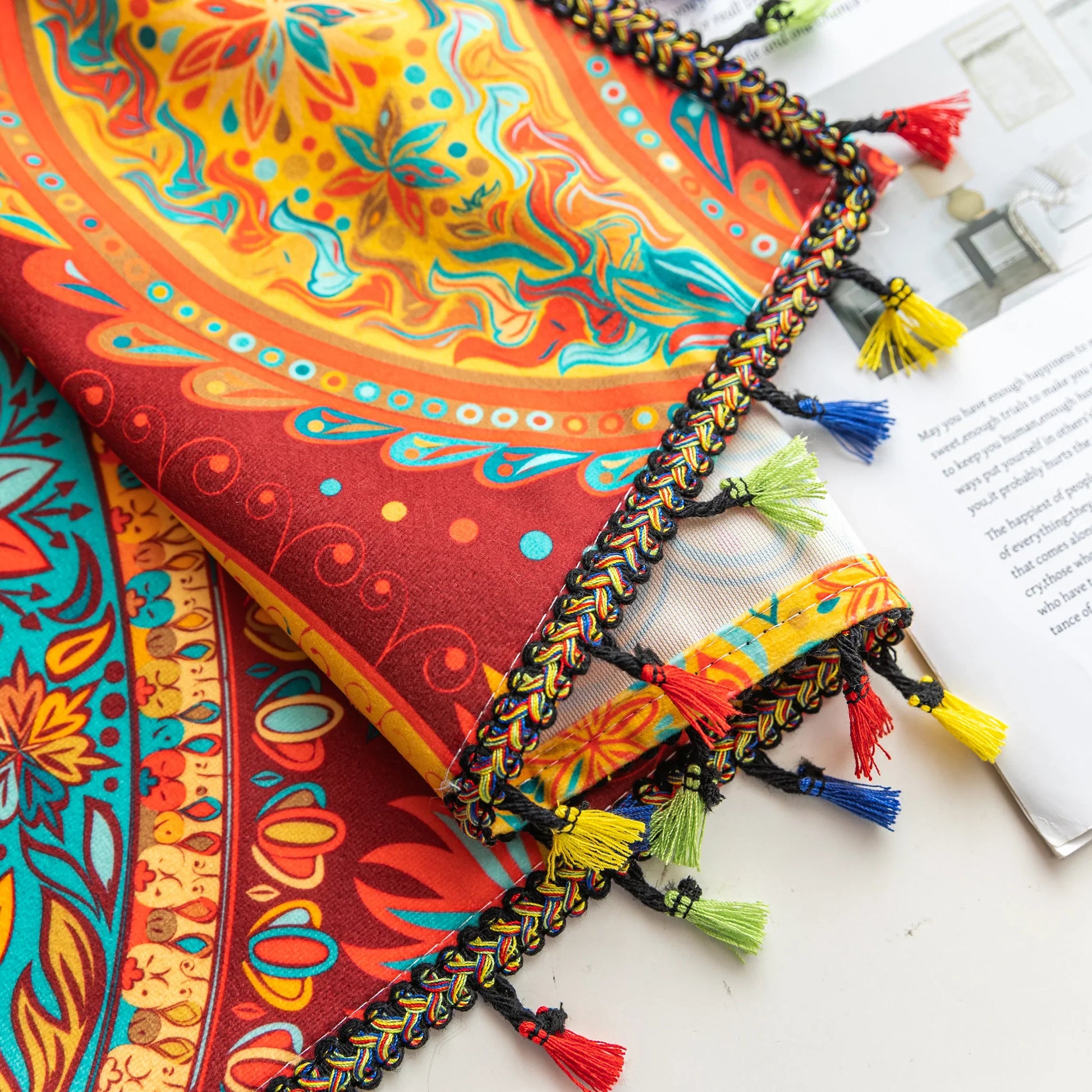 Vibrant bohemian curtain with an intricate paisley pattern in rich red, golden yellow, turquoise, and orange tones, accented with colorful tassel trim — perfect for adding a warm, artistic, and eclectic charm to your living room or bedroom décor.