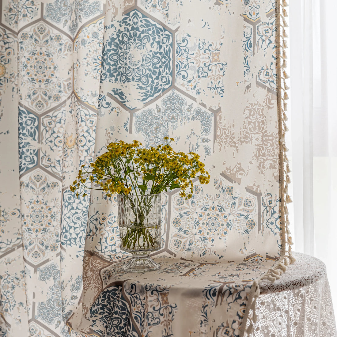 Elegant curtain with a unique hexagon tile-inspired pattern in muted blue, beige, and soft gold tones on a light cream background, finished with delicate fringe trim — perfect for adding a sophisticated, Mediterranean touch to your living space.