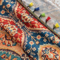 Elegant bohemian curtain featuring a Moroccan-inspired teardrop pattern in warm beige, deep red, and rich blue tones, adorned with intricate floral details and colorful tassel trim — perfect for adding warmth, texture, and global charm to any living space.