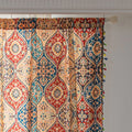 Elegant bohemian curtain featuring a Moroccan-inspired teardrop pattern in warm beige, deep red, and rich blue tones, adorned with intricate floral details and colorful tassel trim — perfect for adding warmth, texture, and global charm to any living space.