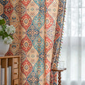 Elegant bohemian curtain featuring a Moroccan-inspired teardrop pattern in warm beige, deep red, and rich blue tones, adorned with intricate floral details and colorful tassel trim — perfect for adding warmth, texture, and global charm to any living space.