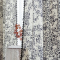 Elegant black and white curtain featuring intricate floral and damask-inspired patterns on a cream background, beautifully finished with matching black tassel trim — perfect for adding timeless sophistication and classic charm to any room décor.