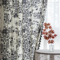 Elegant black and white curtain featuring intricate floral and damask-inspired patterns on a cream background, beautifully finished with matching black tassel trim — perfect for adding timeless sophistication and classic charm to any room décor.