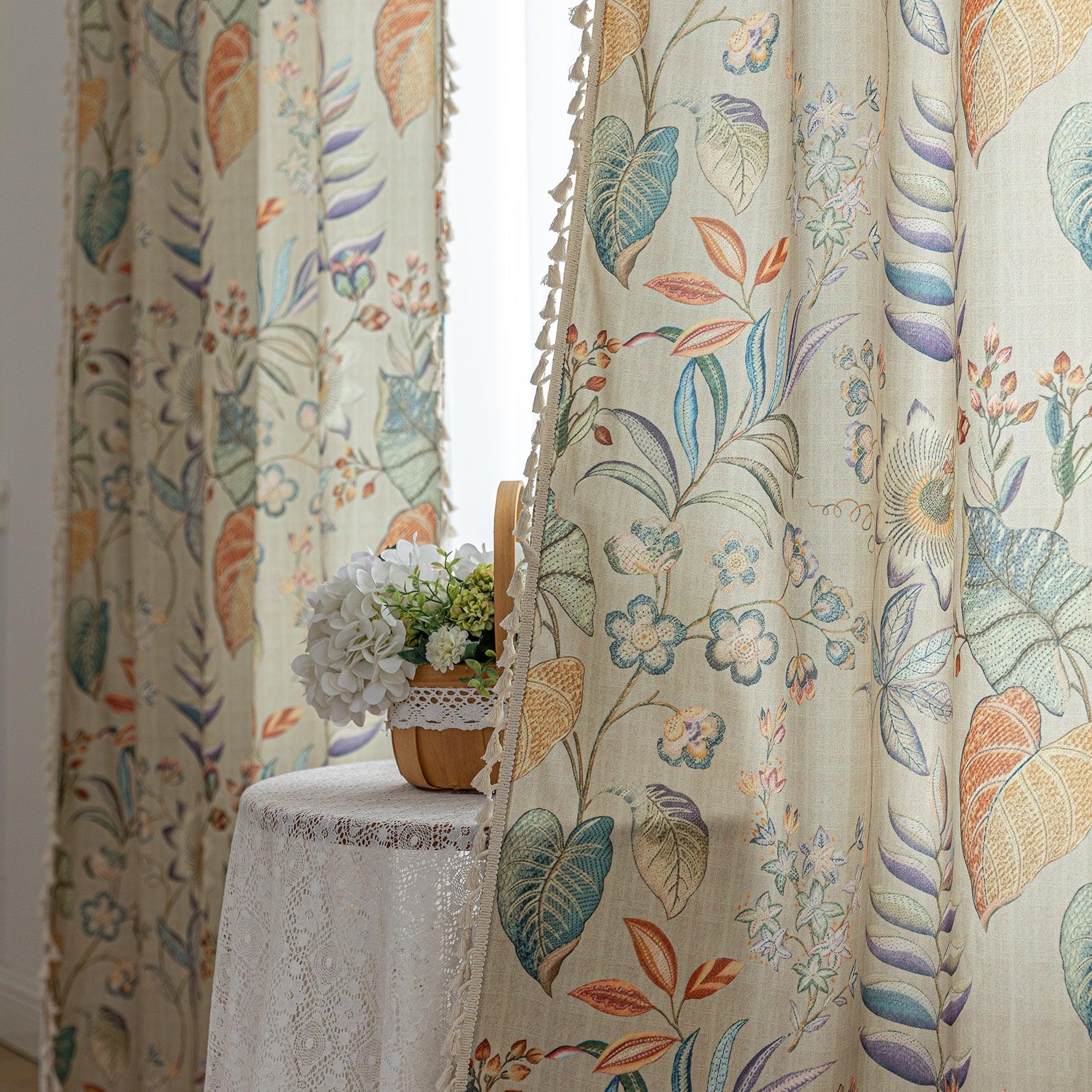 Elegant botanical curtain with a soft beige base, featuring hand-painted style floral and leaf patterns in warm earthy tones and muted pastels, finished with white tassel trim — perfect for bringing a fresh, nature-inspired charm to your home décor.
